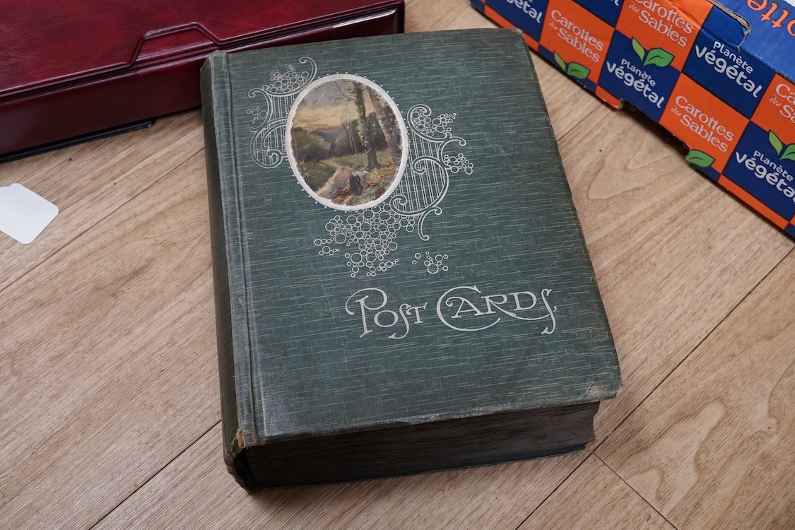 A collection of early 20th century postcards, photographs, etc. Including three albums of novelty postcards, scenes of London, etc. First World War postcards, etc. and an Edwardian photograph album, together with four bo